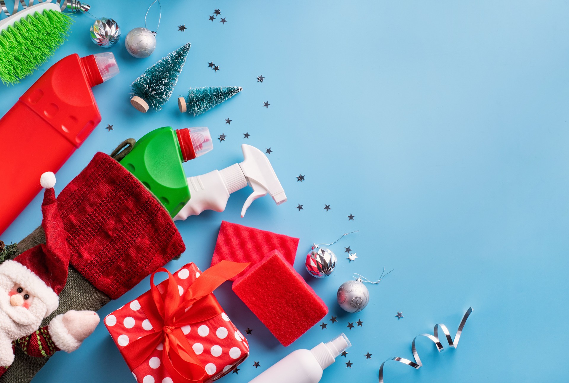cleaning tools and materials in christmas stocking top view flat lay